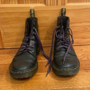 Black Dr. Marten 7 eyelet boots. Tagged size US 8, EU 39, and UK 6.